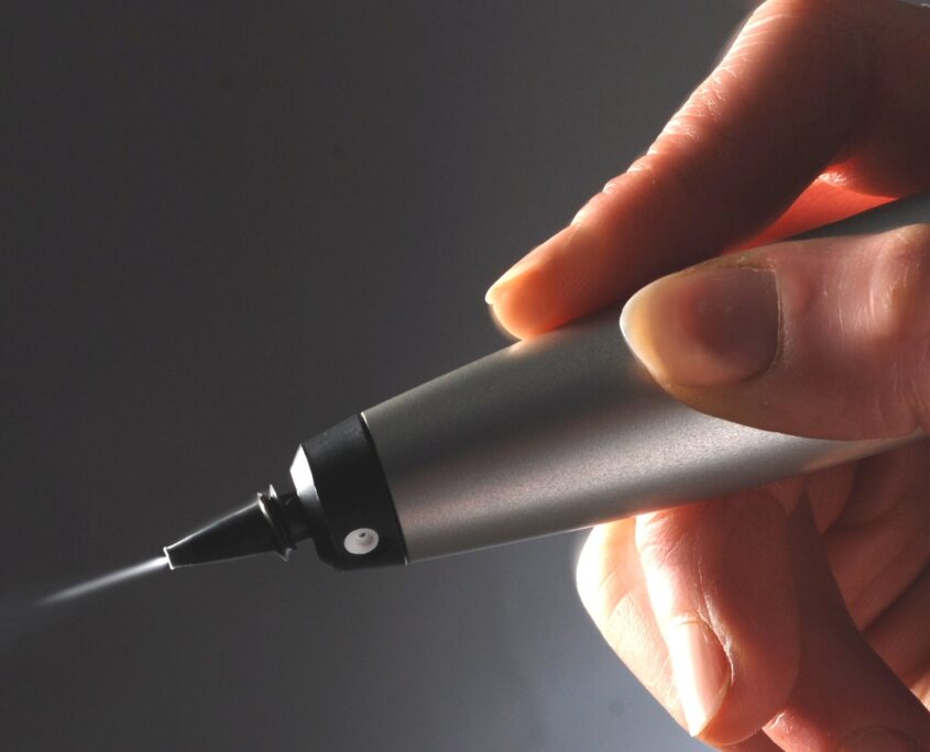 hand holding CryoPen used in Cryotherapy treatments